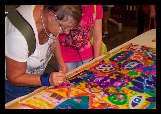Learning how to paint on silk - from young children to our wise elders, they all had fun with Teena Hughes Learning how to paint on silk - from young children to our wise elders, they all had fun
